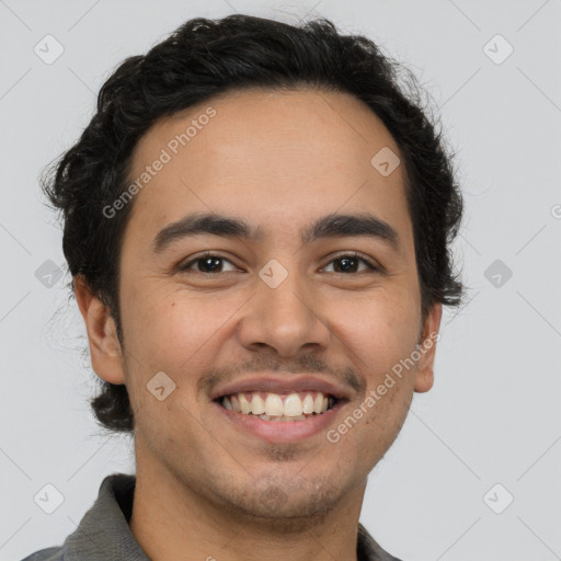 Joyful latino young-adult male with short  brown hair and brown eyes