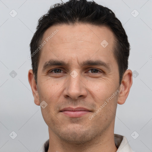 Joyful white adult male with short  brown hair and brown eyes