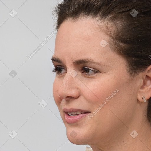 Joyful white adult female with short  brown hair and brown eyes