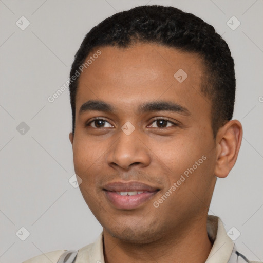 Joyful black young-adult male with short  black hair and brown eyes