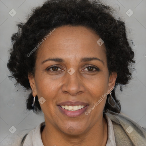 Joyful black adult female with medium  brown hair and brown eyes