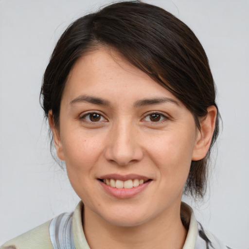 Joyful white young-adult female with medium  brown hair and brown eyes