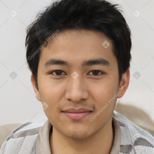 Joyful asian young-adult male with short  brown hair and brown eyes