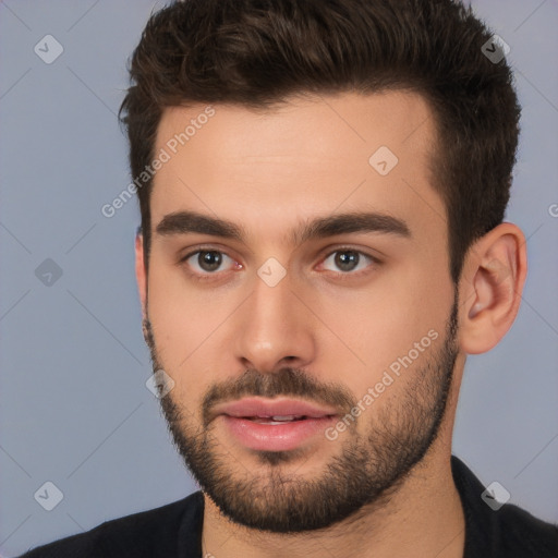 Neutral white young-adult male with short  brown hair and brown eyes