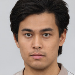 Neutral asian young-adult male with short  brown hair and brown eyes