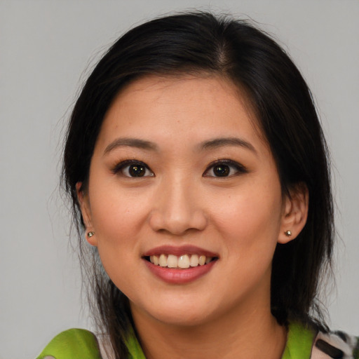 Joyful white young-adult female with medium  brown hair and brown eyes
