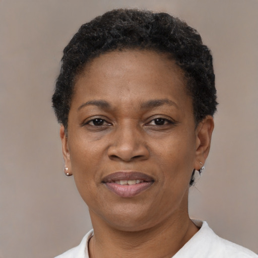Joyful black adult female with short  black hair and brown eyes