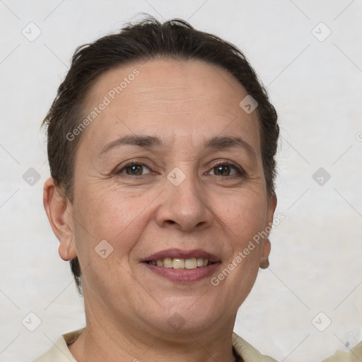 Joyful white adult female with short  brown hair and brown eyes