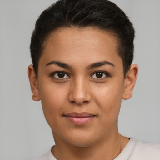 Joyful latino young-adult female with short  brown hair and brown eyes