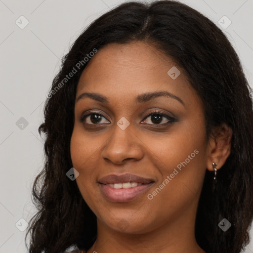 Joyful black young-adult female with long  brown hair and brown eyes