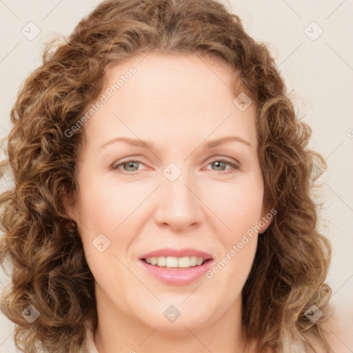 Joyful white young-adult female with long  brown hair and green eyes