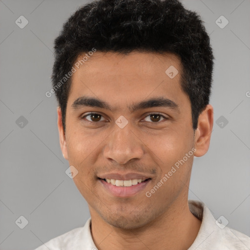 Joyful white young-adult male with short  black hair and brown eyes