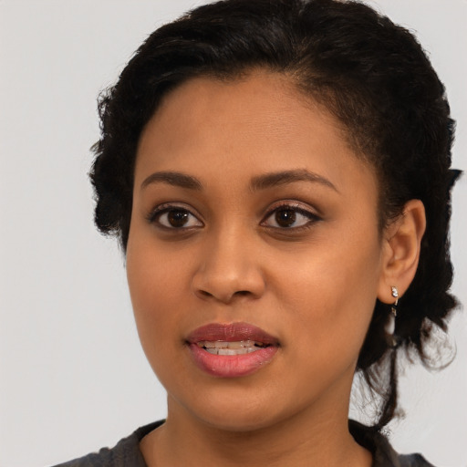 Joyful latino young-adult female with short  brown hair and brown eyes