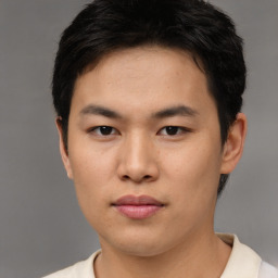 Neutral asian young-adult male with short  brown hair and brown eyes