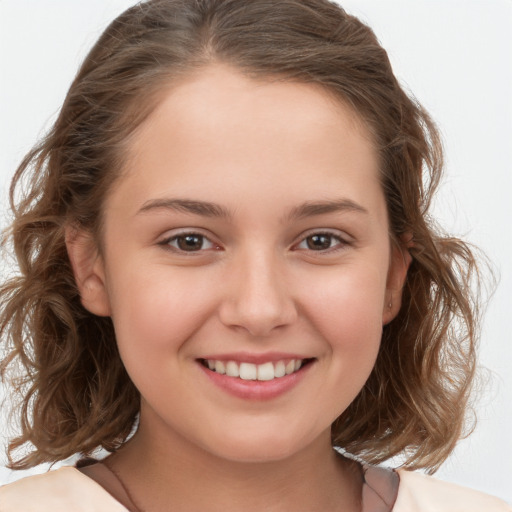 Joyful white child female with medium  brown hair and brown eyes