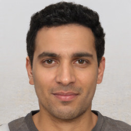 Neutral white young-adult male with short  black hair and brown eyes