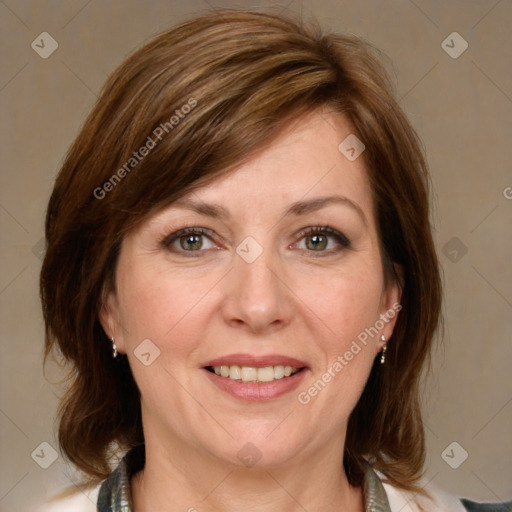 Joyful white adult female with medium  brown hair and grey eyes