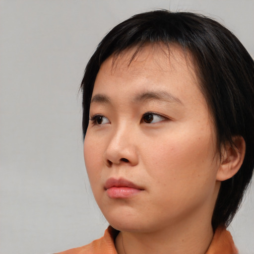 Neutral asian young-adult female with medium  brown hair and brown eyes