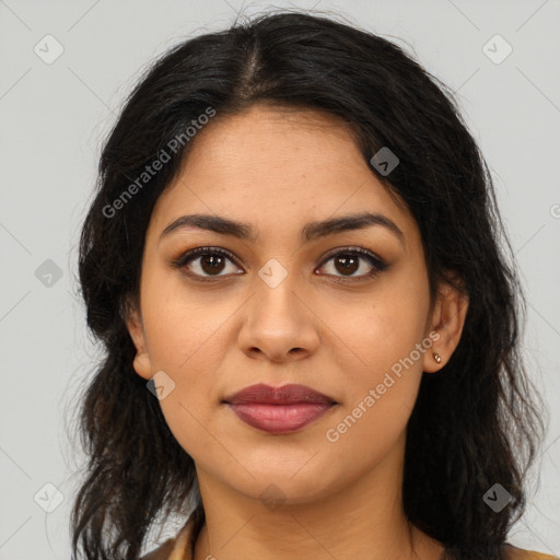 Joyful latino young-adult female with long  brown hair and brown eyes