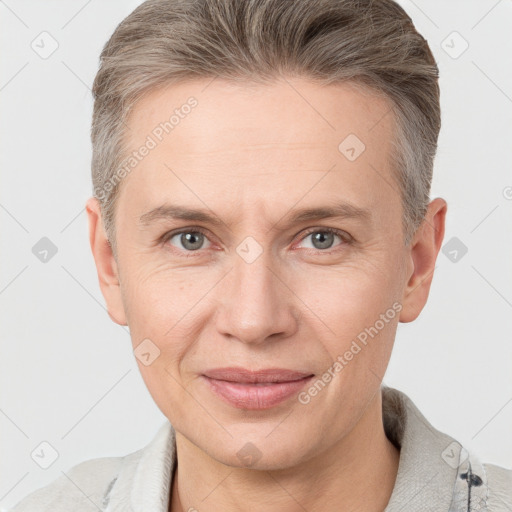 Joyful white adult male with short  brown hair and grey eyes