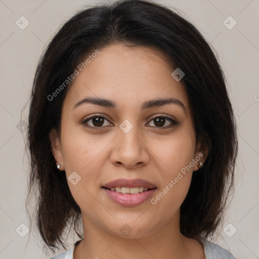 Joyful latino young-adult female with medium  brown hair and brown eyes