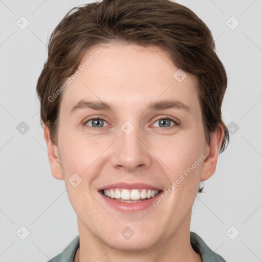 Joyful white young-adult female with short  brown hair and grey eyes