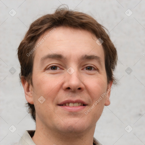 Joyful white adult male with short  brown hair and grey eyes