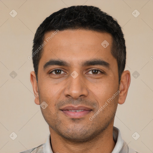 Joyful latino young-adult male with short  black hair and brown eyes