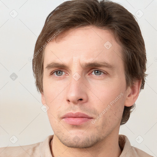 Neutral white young-adult male with short  brown hair and grey eyes