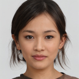 Neutral asian young-adult female with medium  brown hair and brown eyes