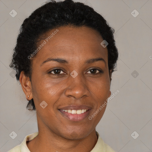 Joyful black adult female with short  brown hair and brown eyes