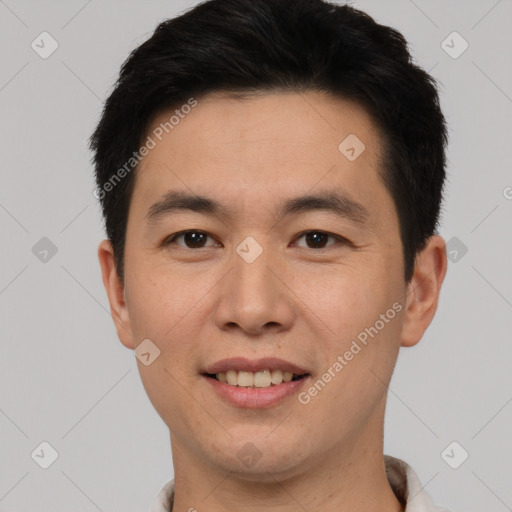 Joyful white young-adult male with short  black hair and brown eyes