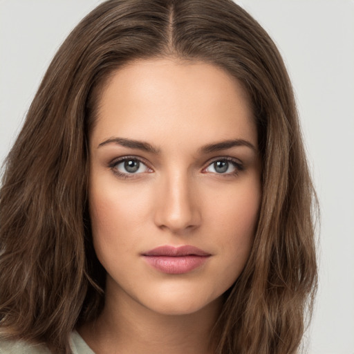 Neutral white young-adult female with long  brown hair and brown eyes