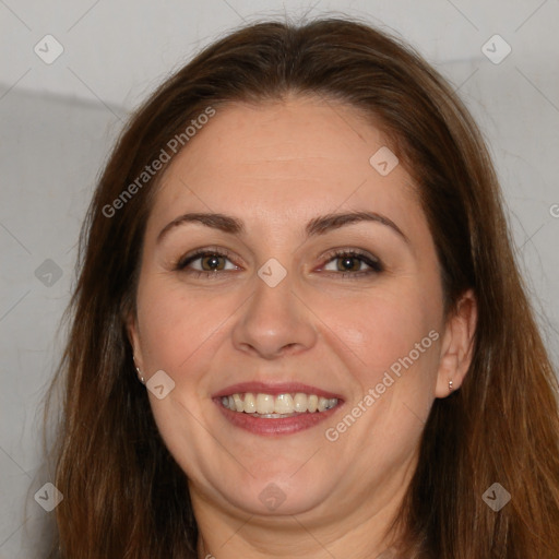 Joyful white adult female with long  brown hair and brown eyes