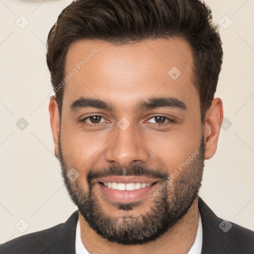 Joyful white young-adult male with short  brown hair and brown eyes