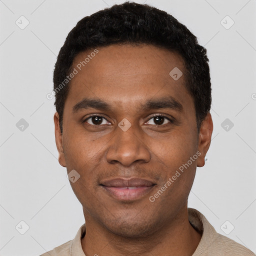 Joyful black young-adult male with short  black hair and brown eyes