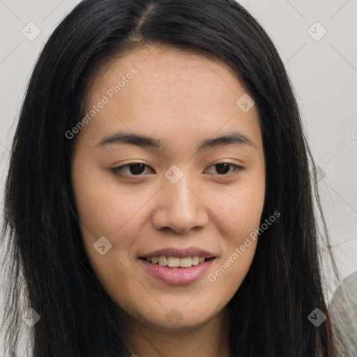 Joyful asian young-adult female with long  brown hair and brown eyes