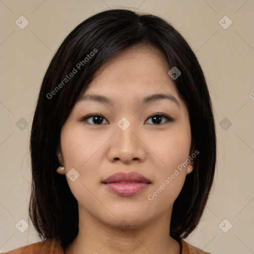 Joyful asian young-adult female with medium  black hair and brown eyes