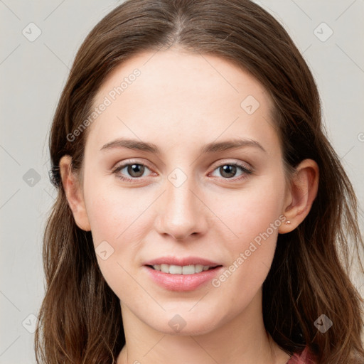 Joyful white young-adult female with long  brown hair and grey eyes