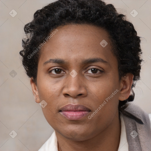 Joyful black adult female with short  brown hair and brown eyes