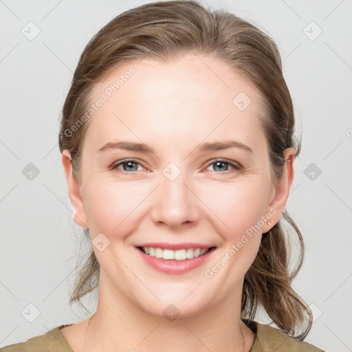 Joyful white young-adult female with medium  brown hair and grey eyes