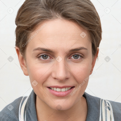 Joyful white young-adult female with short  brown hair and grey eyes