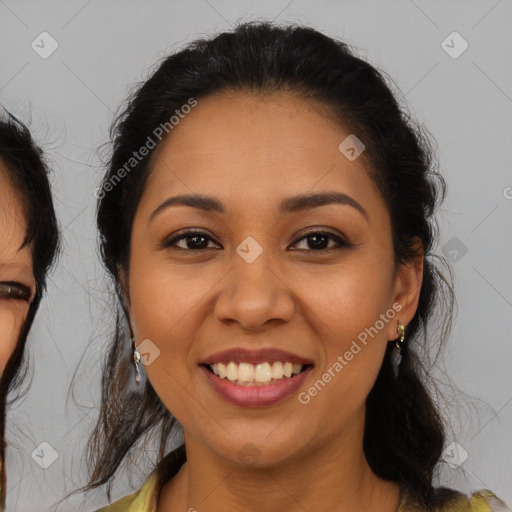 Joyful latino young-adult female with medium  brown hair and brown eyes