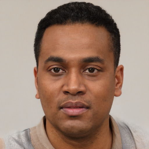 Neutral latino young-adult male with short  black hair and brown eyes