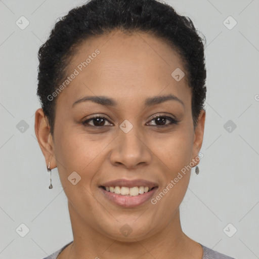 Joyful black young-adult female with short  brown hair and brown eyes