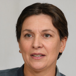 Joyful white adult female with short  brown hair and brown eyes