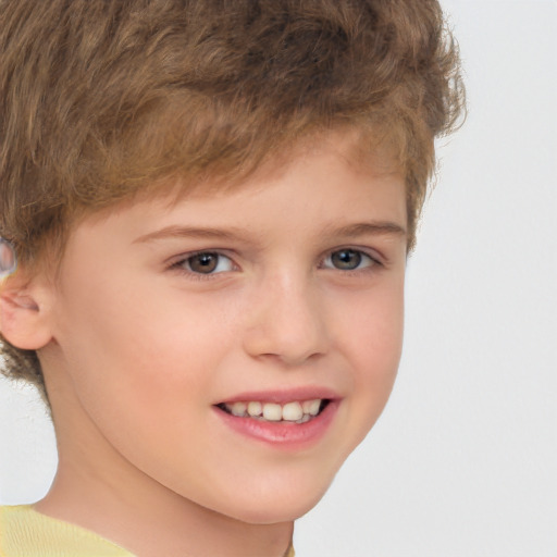 Joyful white child male with short  brown hair and brown eyes