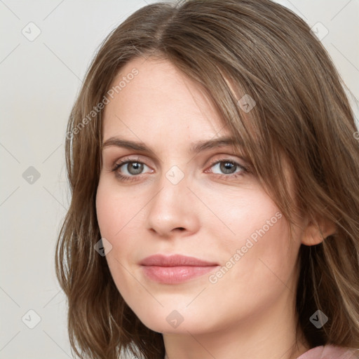 Joyful white young-adult female with medium  brown hair and green eyes