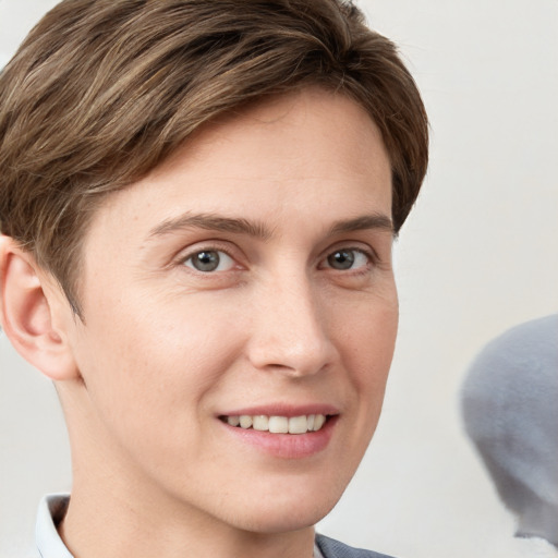 Joyful white young-adult female with short  brown hair and grey eyes