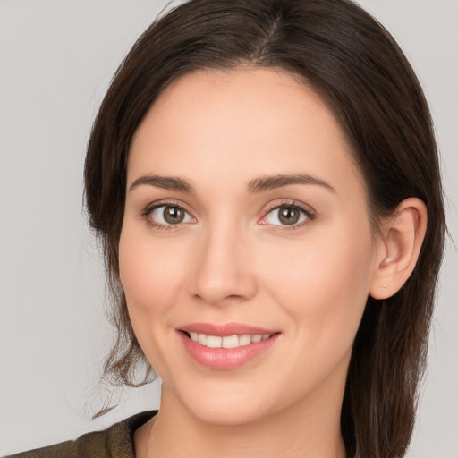 Joyful white young-adult female with medium  brown hair and brown eyes